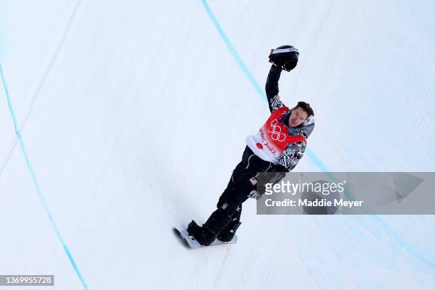 Shaun White of Team United States reacts during this third run in the Men's Snowboard Halfpipe Final on day 7 of the Beijing 2022 Winter Olympics at...