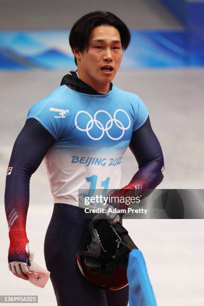 Sungbin Yun of Team South Korea reacts after sliding during the Men's Skeleton Heat 4 on day seven of Beijing 2022 Winter Olympic Games at National...