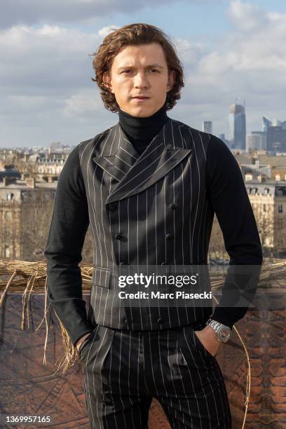 Actor Tom Holland attends the "Uncharted" photocall at cinema Publicis Champs-Elysees on February 11, 2022 in Paris, France.