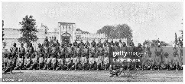 antique travel photographs of india: native troops - india tribal people stock illustrations