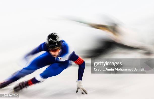 Denis Nikisha of Team Kazakhstan and Jordan Pierre-Gilles of Team Canada compete at the finish line during the Men's 500m Heats on day seven of the...