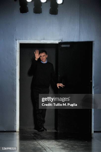 Designer Raf Simons acknowledges the applause of the audience after the Jil Sander fashion show as part of Milan Fashion Week Menswear Autumn/Winter...