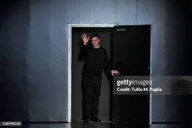 Designer Raf Simons acknowledges the applause of the audience after the Jil Sander fashion show as part of Milan Fashion Week Menswear Autumn/Winter...