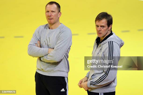 Assistant coach Frank Carstens and head coach Martin Heuberger watch the Germany training session at Cair Sports Centre on January 14, 2011 in Nis,...