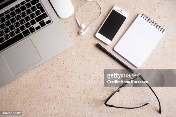 directly above shot of office desk and stationery on concrete background. flat lay - office work flat lay stock pictures, royalty-free photos & images