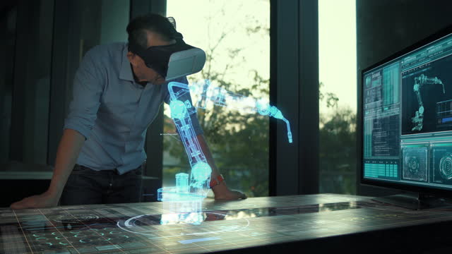 Futuristic male Engineer Wearing Virtual Reality Glasses working with a futuristic hologram industry technology robot arm control,futuristic industry ideas.