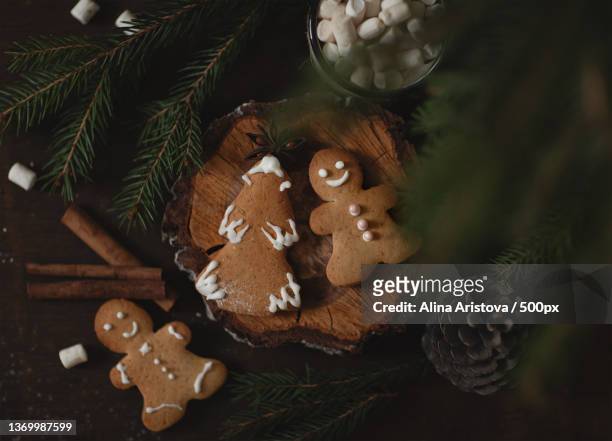 belated holiday,high angle view of cookies with christmas decorations on table - gingerbread cake stock pictures, royalty-free photos & images