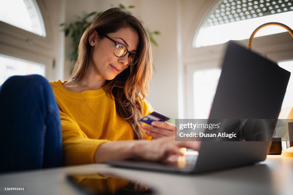 Beautiful young woman working at home