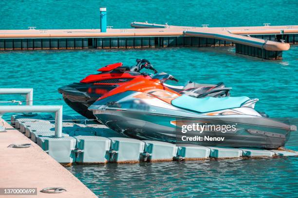 image of a jetboat in the harbor - jet ski stock pictures, royalty-free photos & images