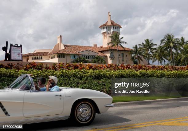 Car passes in front of former President Donald Trump's Mar-a-Lago resort on February 11, 2022 in Palm Beach, Florida. Published reports indicate that...