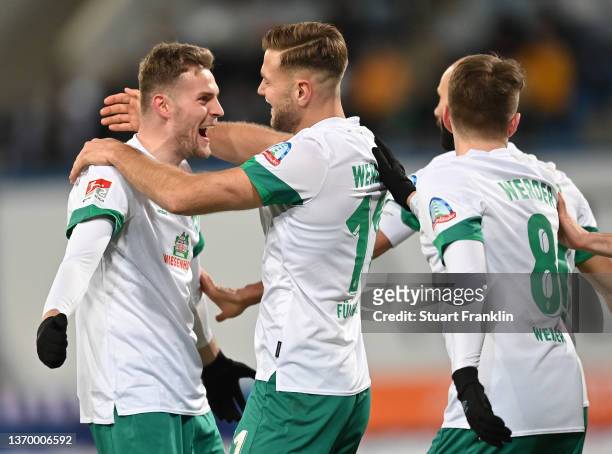 Niclas Füllkrug of Bremen celebrates scoring his goal with Marvin Ducksch during the Second Bundesliga match between FC Hansa Rostock and SV Werder...