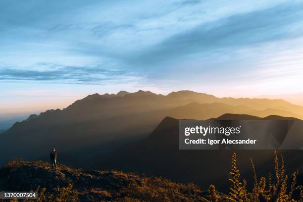man at sunset in mantiqueira mountains, brazil - mantiqueira mountains stock pictures, royalty-free photos & images