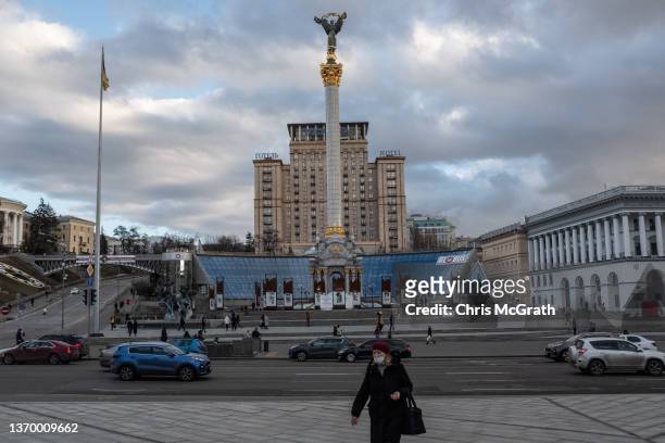 Woman walks in front of Independence Monument on February 11, 2022 in Kyiv, Ukraine. According to recent announcements by U.S President Biden's...