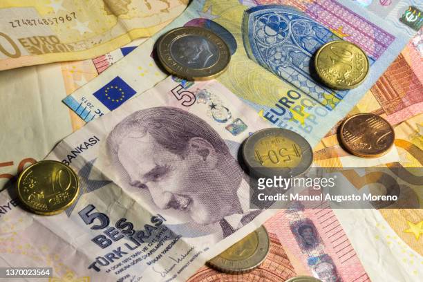 money: turkish lira and euro banknotes and coins - turkish lira stock pictures, royalty-free photos & images