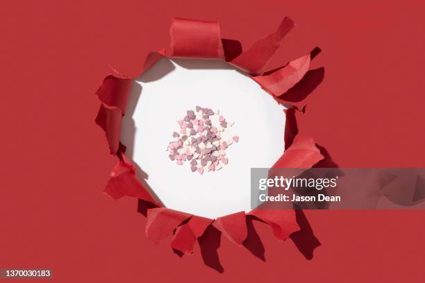 torn red paper and heart decors - torn gift stock pictures, royalty-free photos & images