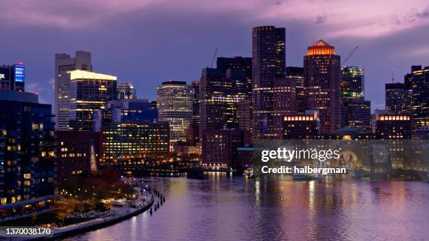 drone shot of fan pier and rowes wharf at twilight in boston, ma - boston harbour stock pictures, royalty-free photos & images