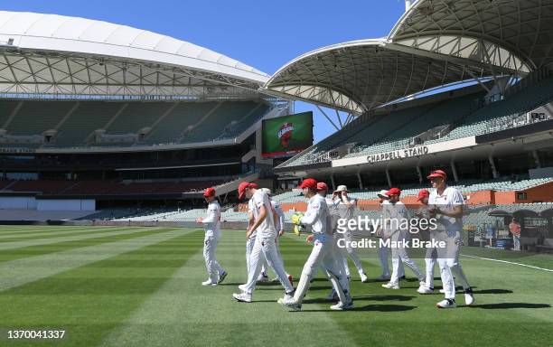 South Australia head out to fieldduring day four of the Sheffield Shield match between South Australia and Victoria at Adelaide Oval, on February 12...