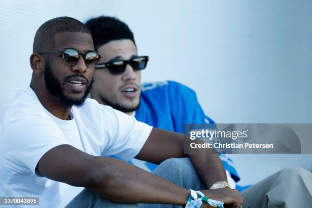 Phoenix Suns players Chris Paul and Devin Booker attend the second round of the WM Phoenix Open at TPC Scottsdale on February 11, 2022 in Scottsdale,...