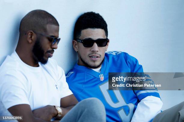 Phoenix Suns players Chris Paul and Devin Booker attend the second round of the WM Phoenix Open at TPC Scottsdale on February 11, 2022 in Scottsdale,...