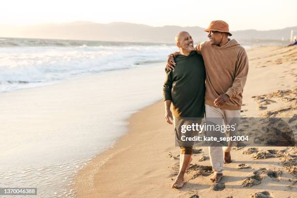 financial decisions - gay seniors stock pictures, royalty-free photos & images