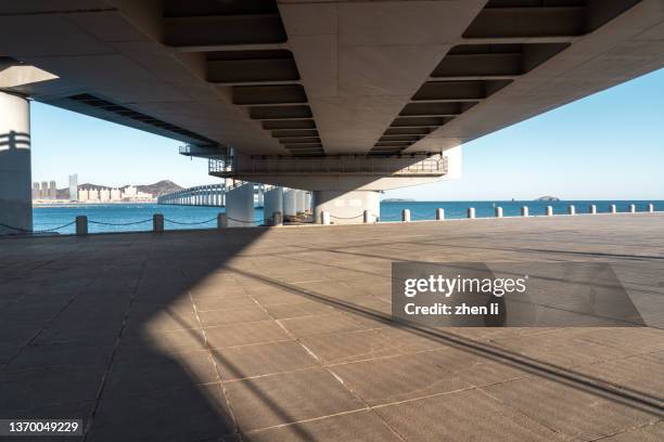 road under the viaduct - bridge low angle view stock pictures, royalty-free photos & images