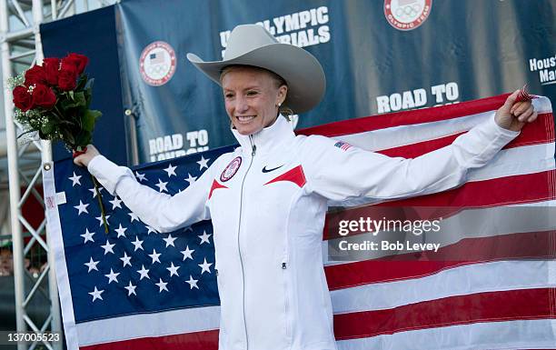 Shalane Flanagan poses with her cowboy hat and American flag after winning the U.S. Marathon Olympic Trials on January 14, 2012 in Houston, Texas.