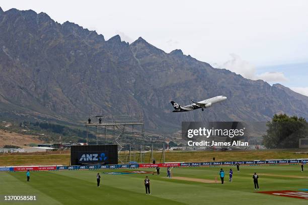 An Air New Zealand plane takes off during game one of the One Day International Series between the New Zealand White Ferns and India at John Davies...