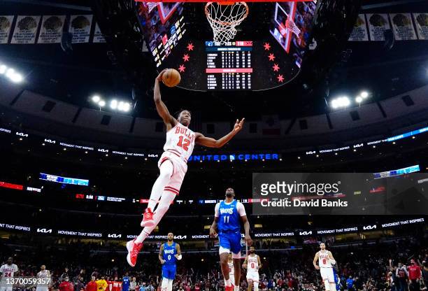 Ayo Dosunmu of the Chicago Bulls goes up for a dunk against the Minnesota Timberwolves during the second half at United Center on February 11, 2022...
