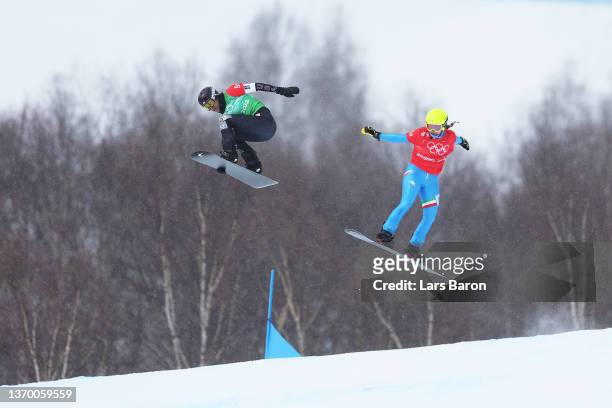 Lindsey Jacobellis of Team United States and Michela Moioli of Team Italy compete during the Snowboard Mixed Team Cross Big Final on Day 8 of the...