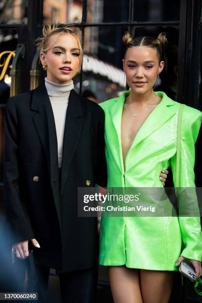 Emma Brooks wearing turtleneck and black coat & Olivia Ponton is seen wearing green blazer outside Bronx & Branco during New York Fashion Week on...