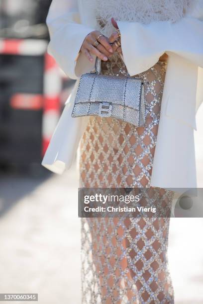 Leonie Hanne seen wearing sheer skirt, white blazer, silver Balenciaga bag, white top outside Bronx & Branco during New York Fashion Week on February...