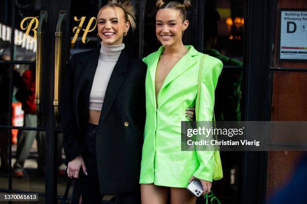 Emma Brooks wearing turtleneck and black coat & Olivia Ponton is seen wearing green blazer outside Bronx & Branco during New York Fashion Week on...