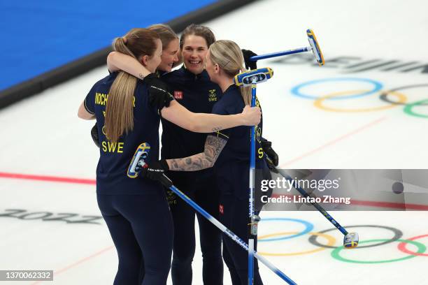 Agnes Knochenhauer, Sara McManus, Anna Hasselborg and Sofia Mabergs of Team Sweden celebrate after a win against Team Canada during the Women's Round...