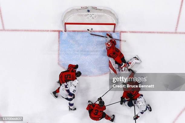 Goaltender Eddie Pasquale of Team Canada can't make the save on a shot for a goal by Ben Meyers of Team United States in the first period during the...