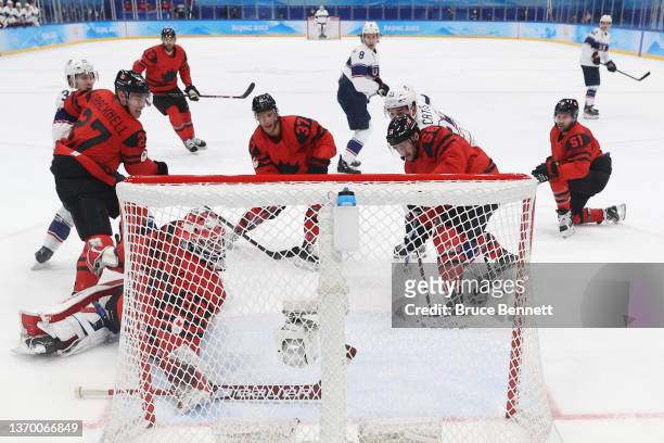 Goaltender Eddie Pasquale of Team Canada can't make the save on a shot for a goal by Ben Meyers of Team United States in the first period during the...