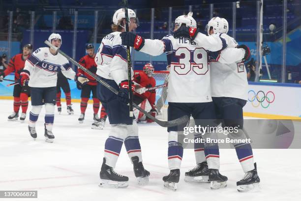 Ben Meyers of Team United States celebrates with Noah Cates, Sean Farrell, Aaron Ness of Team United States and Jake Sanderson after Meyers scored a...