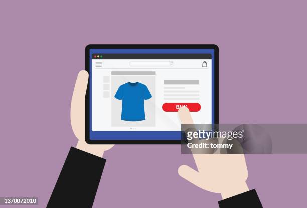 hand holding a tablet for online shopping - t shirtvendor stock illustrations