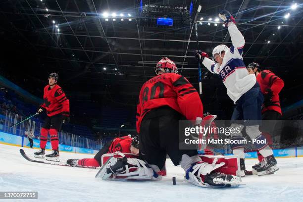 Nathan Smith of Team United States reacts in front of goaltender Eddie Pasquale of Team Canada after Brendan Brisson of Team United States scored a...