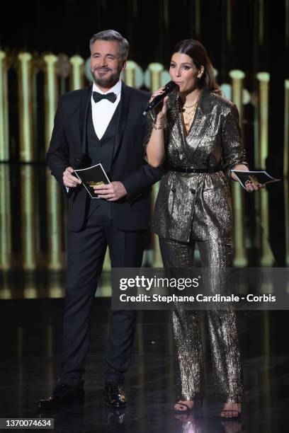 Masters of Ceremony French-Belgian TV host Olivier Minne and TV host Laury Thilleman stand on stage the during the 37th Victoires de la Musique at La...