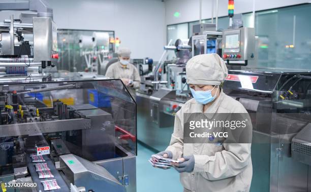 Worker labors on a production line at factory of Qilu Pharmaceutical Co Ltd on February 11, 2022 in Haikou, Hainan Province of China.