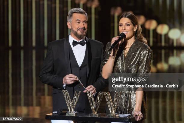 Masters of Ceremony French-Belgian TV host Olivier Minne and TV host Laury Thilleman on stage the during the 37th Victoires de la Musique at La Seine...