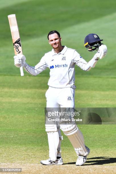 Peter Handscomb of the Bushrangers celebrates bringing up his century during day four of the Sheffield Shield match between South Australia and...