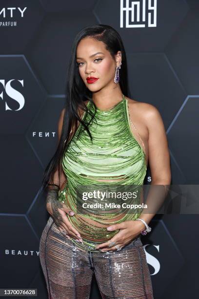 Rihanna poses for a picture as she celebrates her beauty brands fenty beauty and fenty skin at Goya Studios on February 11, 2022 in Los Angeles,...