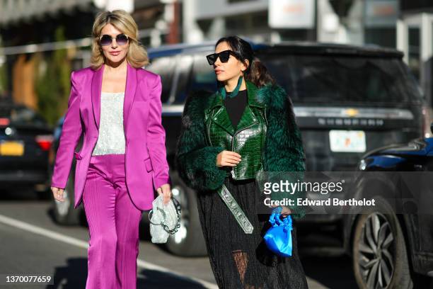 Olga Ferrara wears sunglasses, pearls pendant earrings, a silver sequined / rhinestones square neck t-shirt, a purple fuchsia ribbed oversized blazer...