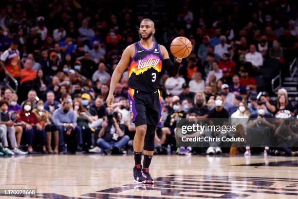 Chris Paul of the Phoenix Suns dribbles the ball during the first half against the Milwaukee Bucks at Footprint Center on February 10, 2022 in...