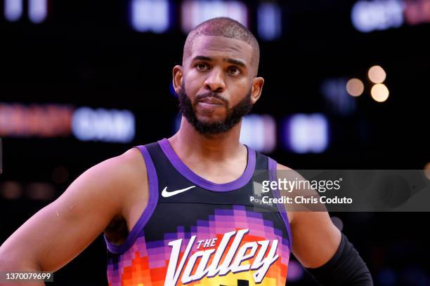 Chris Paul of the Phoenix Suns watches a play during the second half against the Milwaukee Bucks at Footprint Center on February 10, 2022 in Phoenix,...