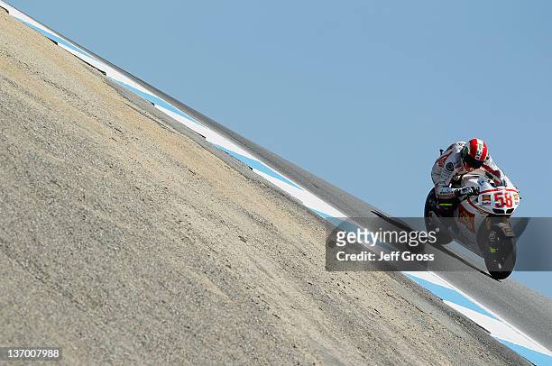 Marco Simoncelli of Italy and San Carlo Honda Gresini rides during qualifying for the Red Bull U.S. Grand Prix at Mazda Raceway Laguna Seca on July...