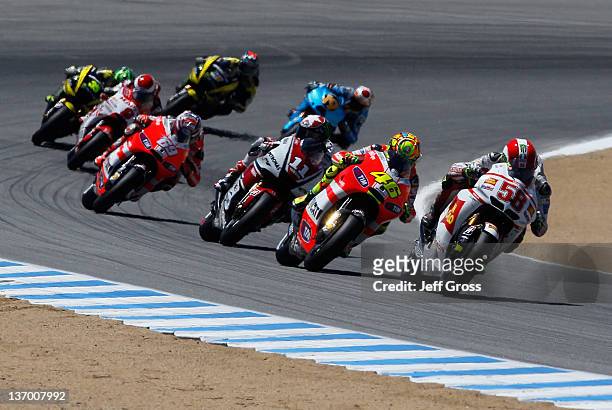 Marco Simoncelli of Italy and San Carlo Honda Gresini leads a pack of riders out of a turn during the Red Bull U.S. Grand Prix at Mazda Raceway...