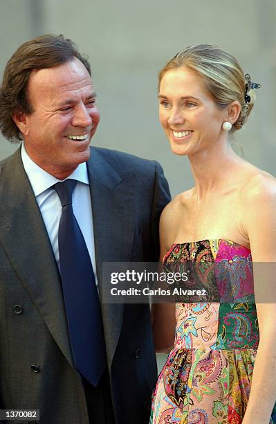 Spanish singer Julio Iglesias and his wife Miranda arrive at the Chapel of the Monastery of El Escorial for the wedding of Ana Aznar, daughter of...