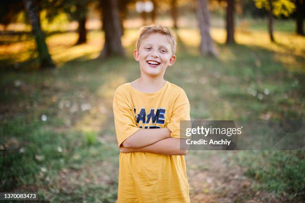 portrait of a smiling little boy in a summer camp - 8 9 years stock pictures, royalty-free photos & images